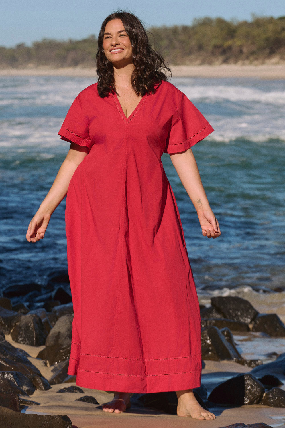Model wearing the Tatum Flutter Sleeve Dress in Red Poplin, A-line silhouette with feminine ease, Adrift Clothing