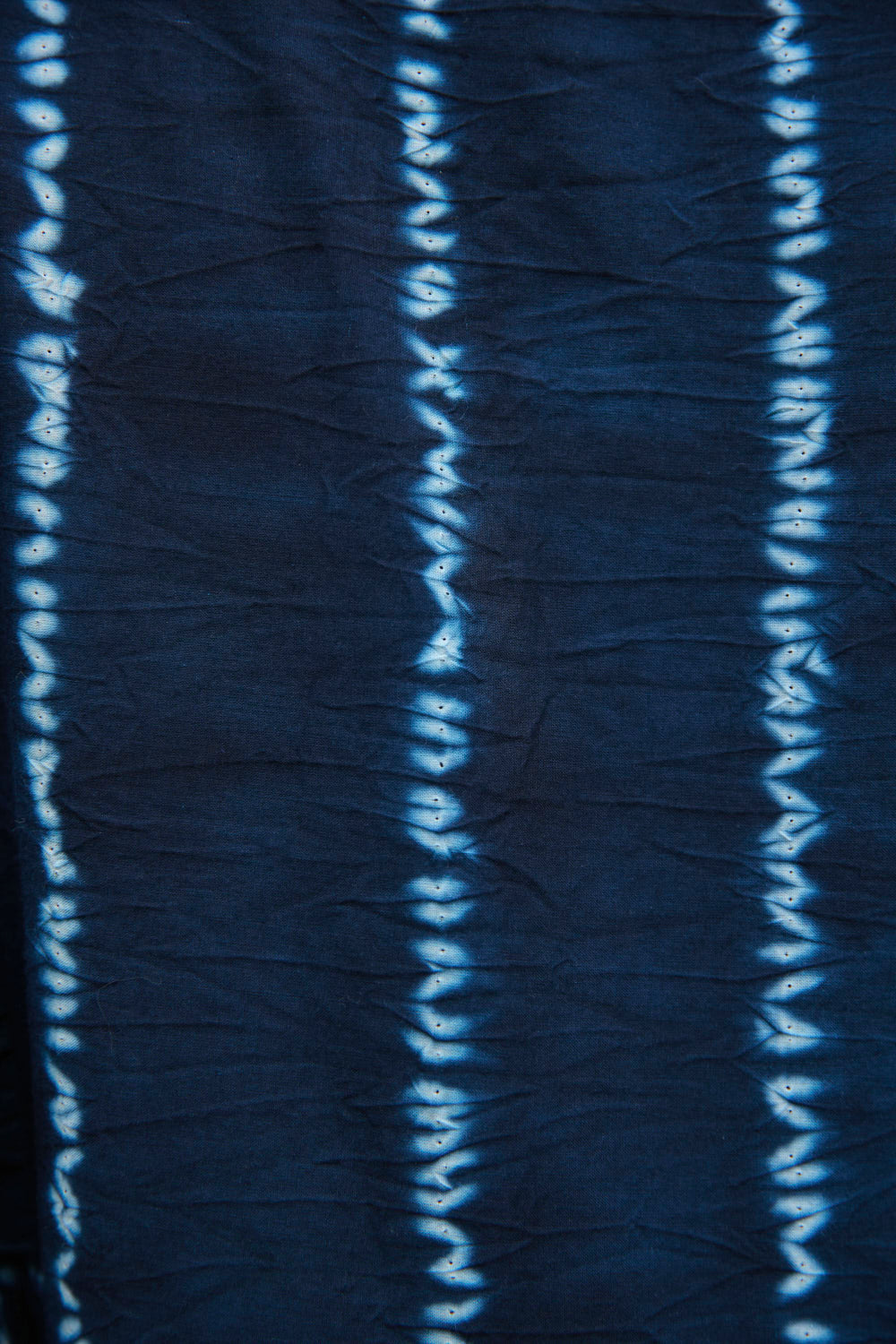 Navy fabric with white stitching pattern