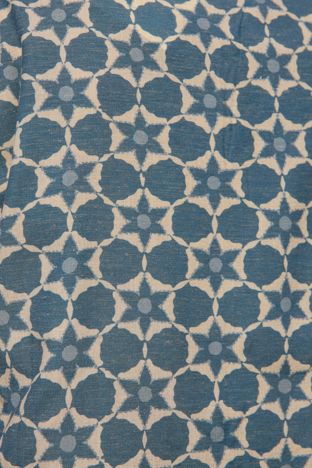 Patterned fabric with blue and beige geometric design
