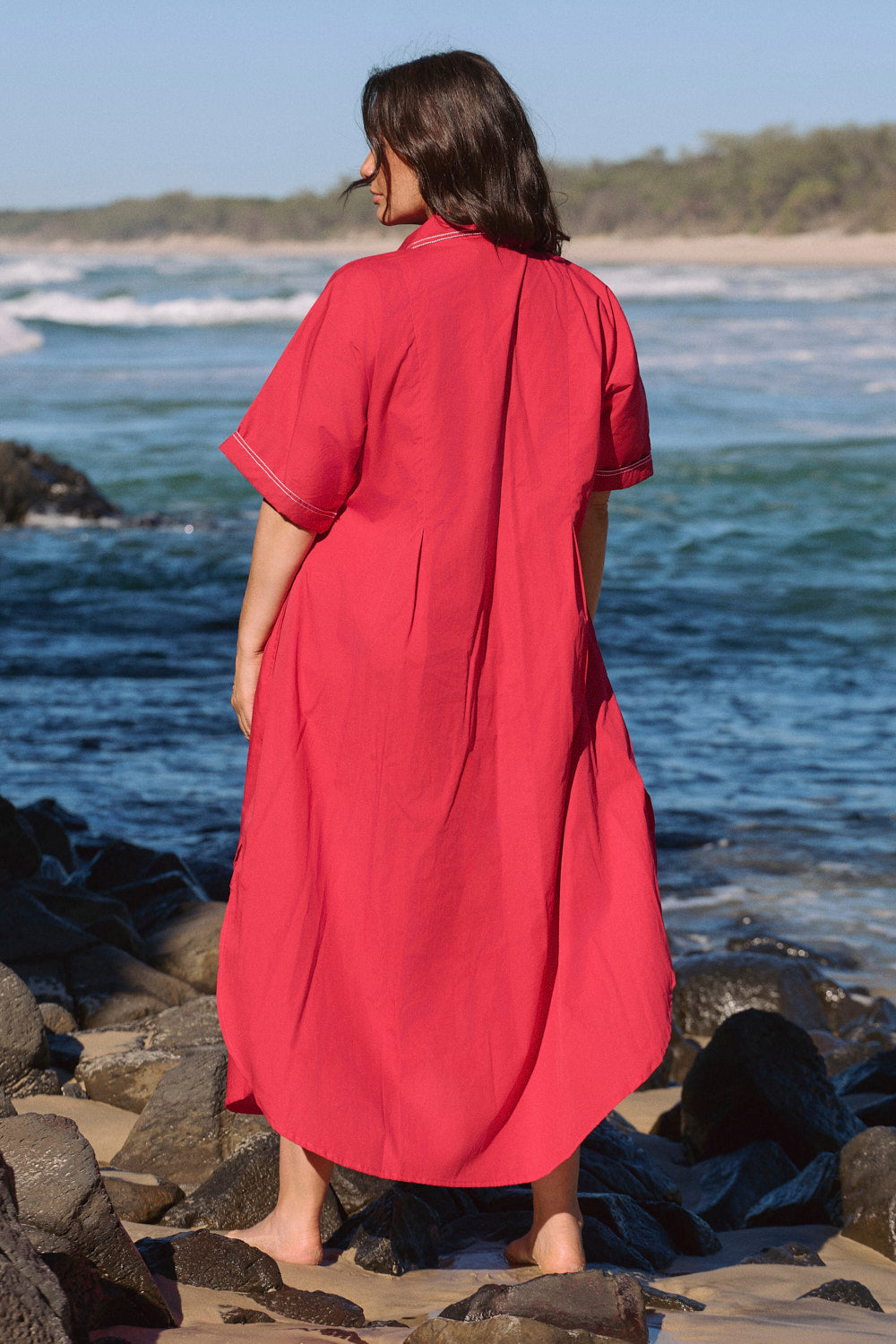 Bridget Pleated Dress in Red Poplin with side hem splits and contrast stitching details, Adrift Clothing