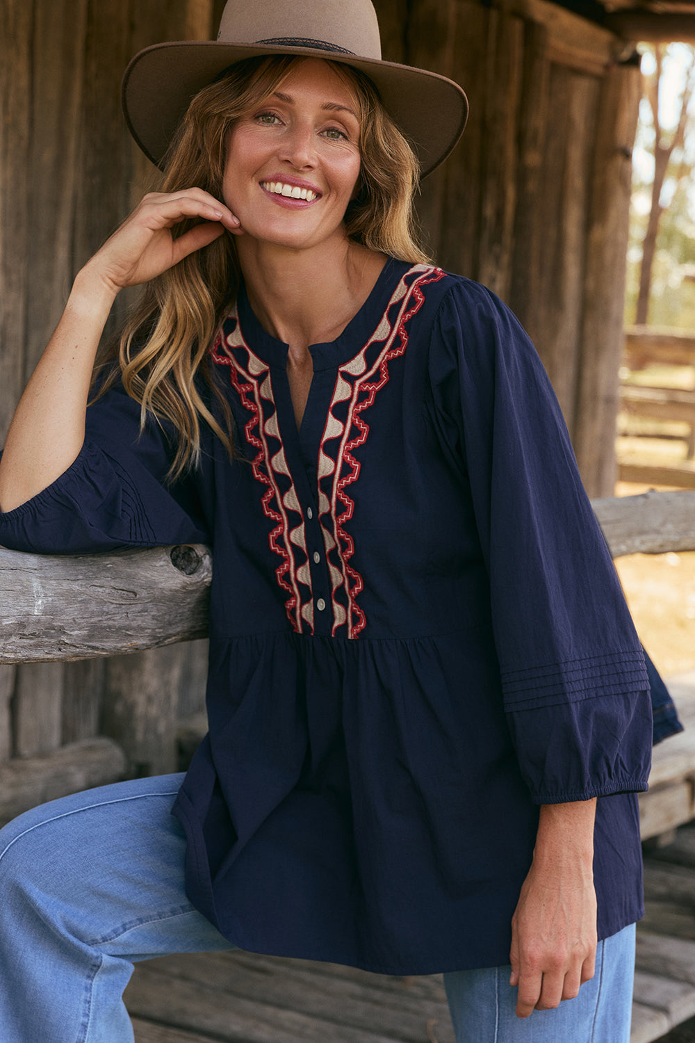 Model wearing the Elodie Smock Blouse in Nocturne with gentle volume through the sleeves, Adrift Clothing
