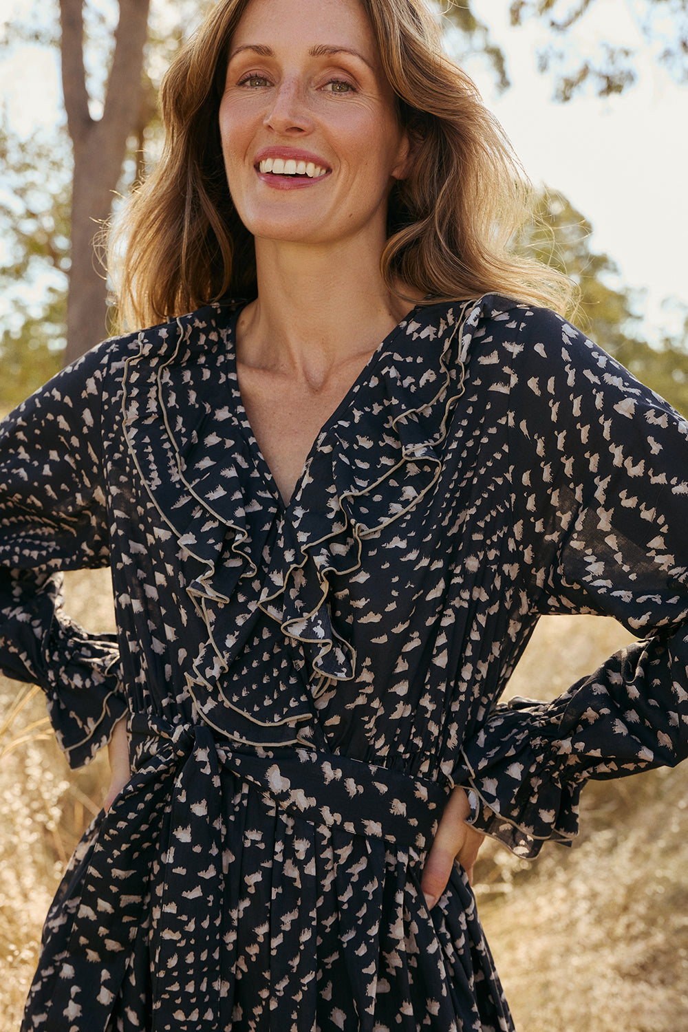 Model wearing the Maye Frill Dress in Wild Jasmine with v-opening neckline, Adrift Clothing