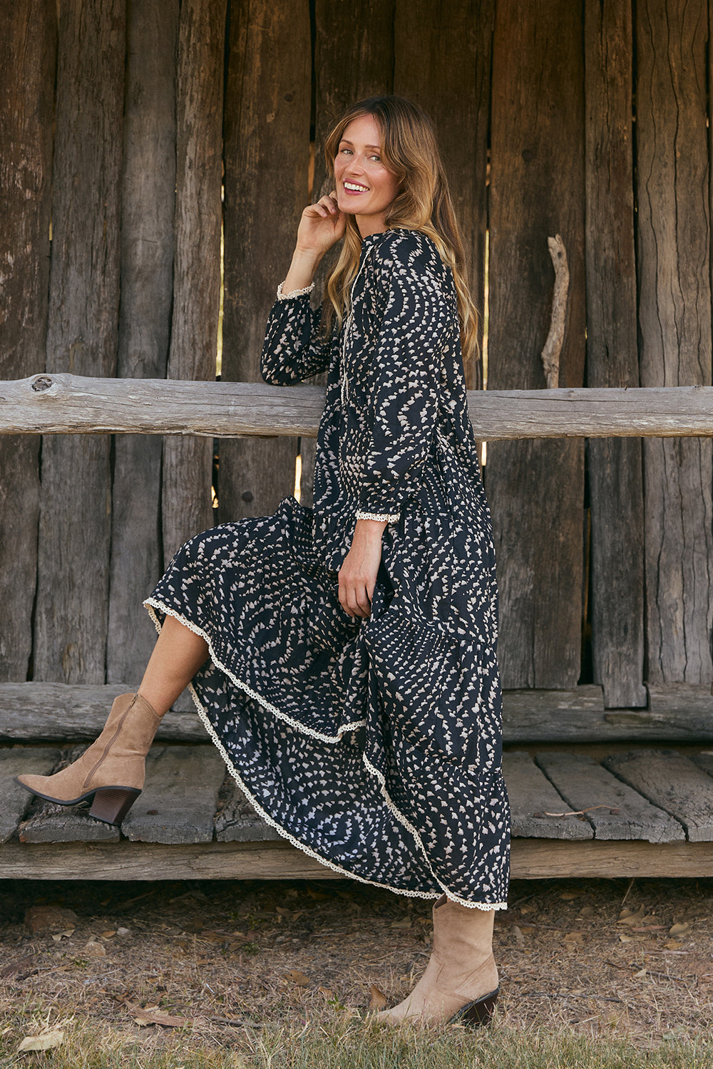 Model wearing the Savannah Tiered Dress in Wild Jasmine with v-opening neckline, Adrift Clothing