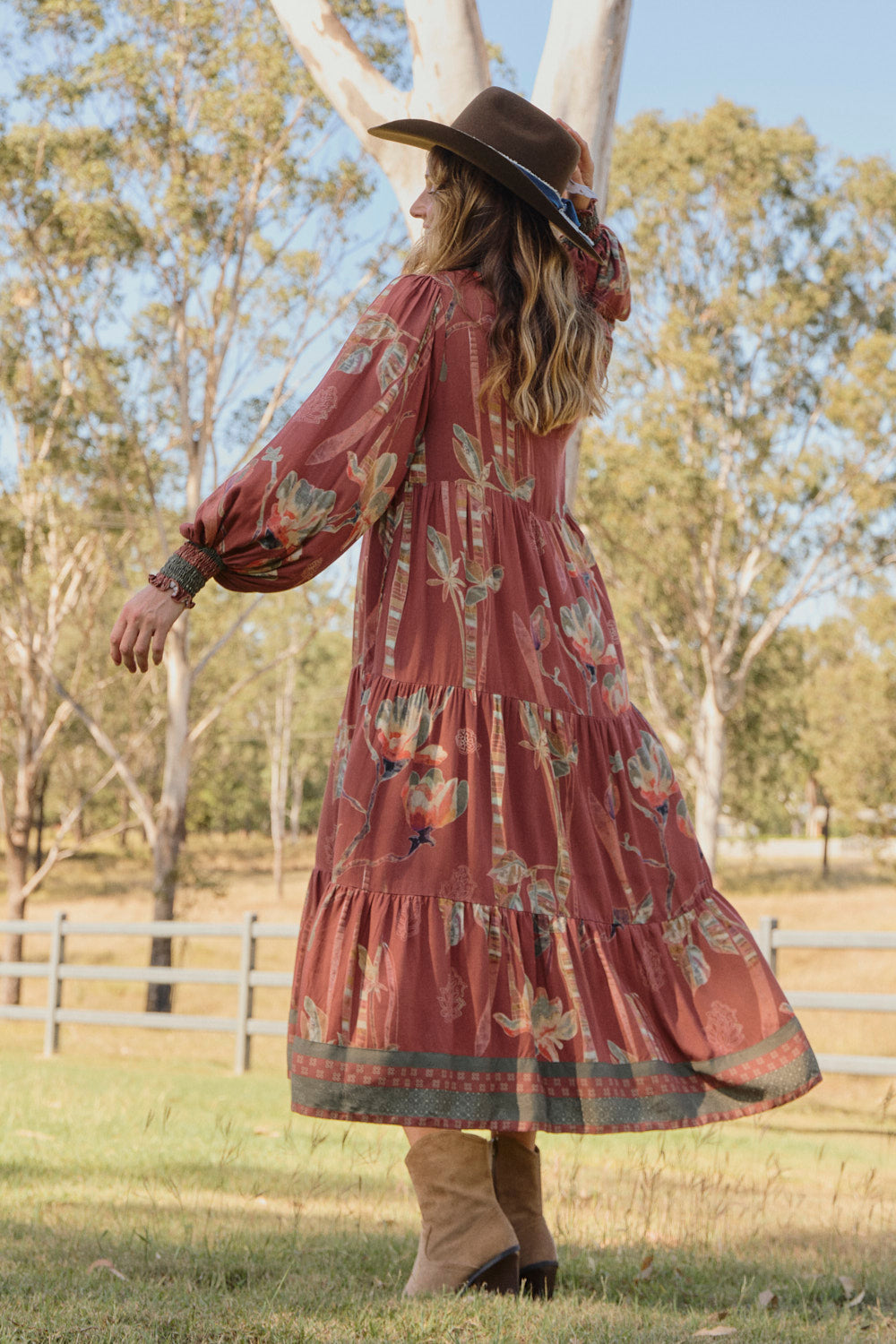 Model wearing the Sienna Billow Sleeve Dress in Outback with long billow sleeves and shirred cuffs, Adrift Clothing